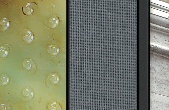 An abstract closeup of a catalog showing the texture of the gray cloth binding.